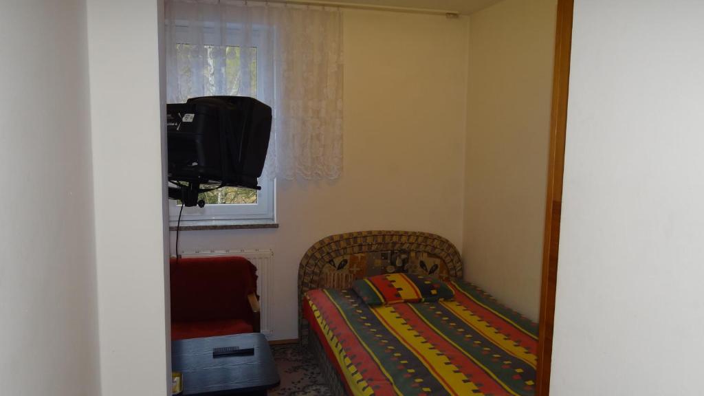 Postel nebo postele na pokoji v ubytování Ośrodek Wypoczynkowy "Hotel Korona"