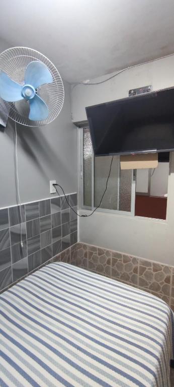 Postel nebo postele na pokoji v ubytování Hostal Arica 3