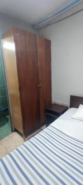 Postel nebo postele na pokoji v ubytování Hostal Arica 3