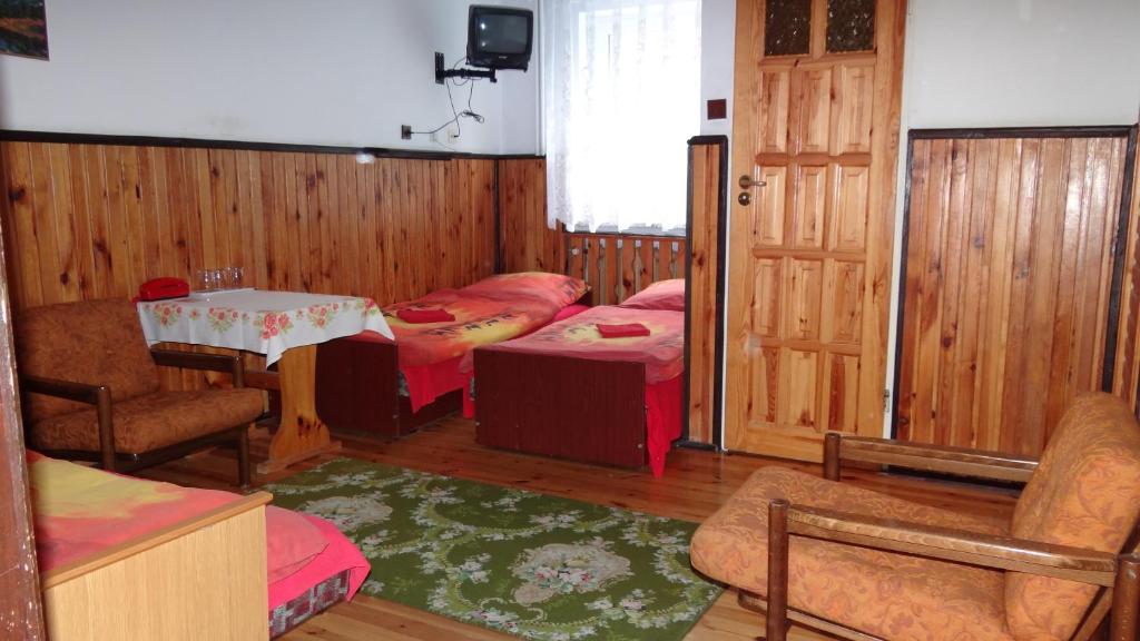 Postel nebo postele na pokoji v ubytování Ośrodek Wypoczynkowy "Hotel Korona"