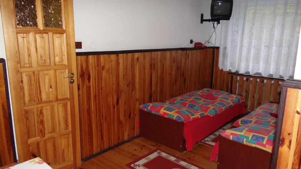 Postel nebo postele na pokoji v ubytování Ośrodek Wypoczynkowy "Hotel Korona"