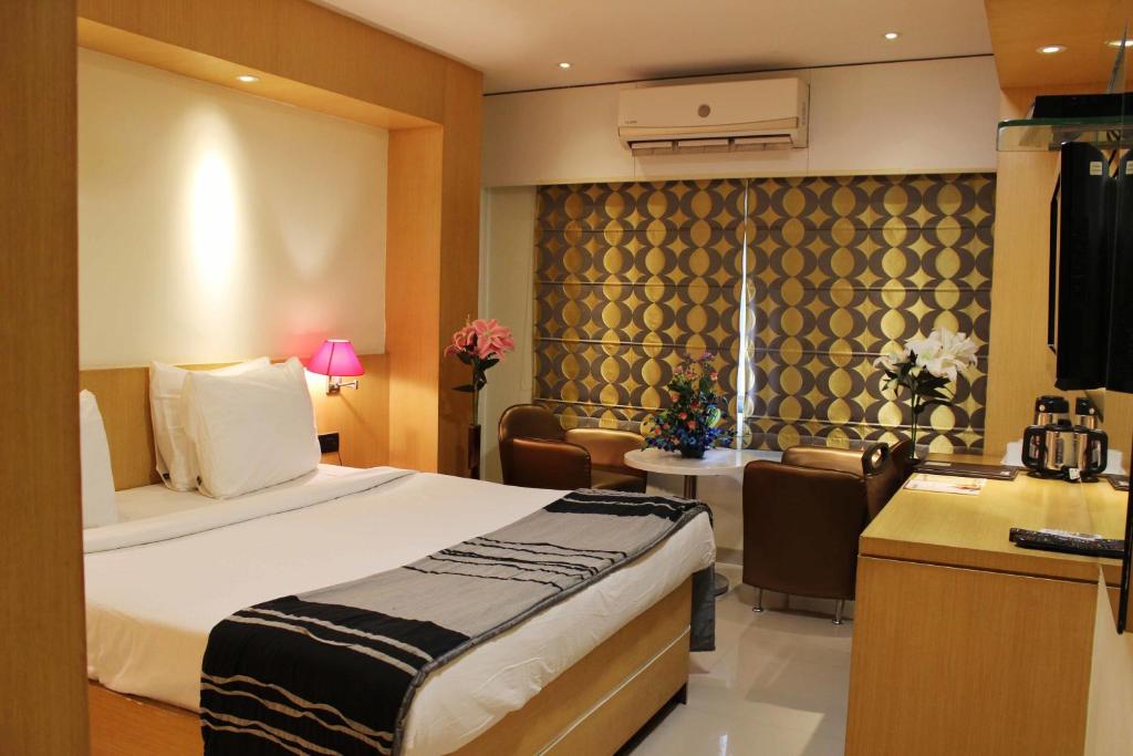 Postel nebo postele na pokoji v ubytování Hotel Oriental Aster - Mumbai International Airport