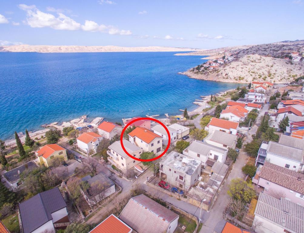 an aerial view of a house by the water at Apartments by the sea Ribarica, Karlobag - 15907 in Ribarica