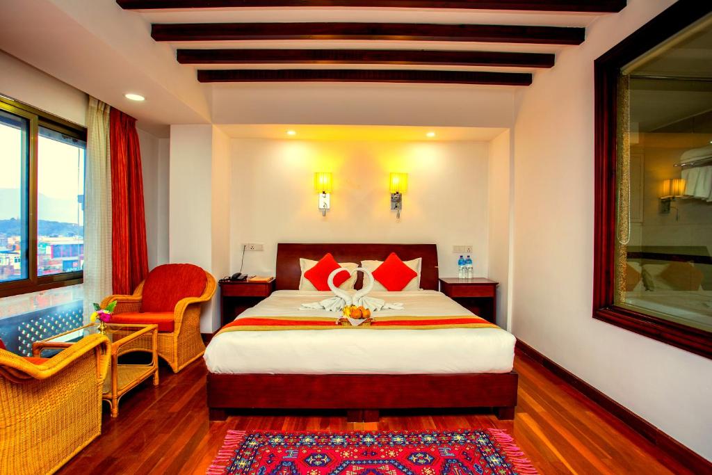 Postel nebo postele na pokoji v ubytování Apsara Boutique Hotel