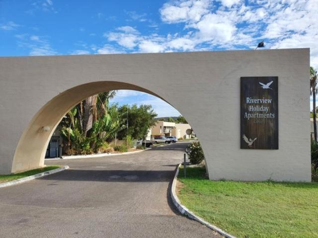 a building with an arch in the middle of a street at RIVERVIEW HOLIDAY APARTMENTS Formerly Kalbarri Beach Resort in Kalbarri