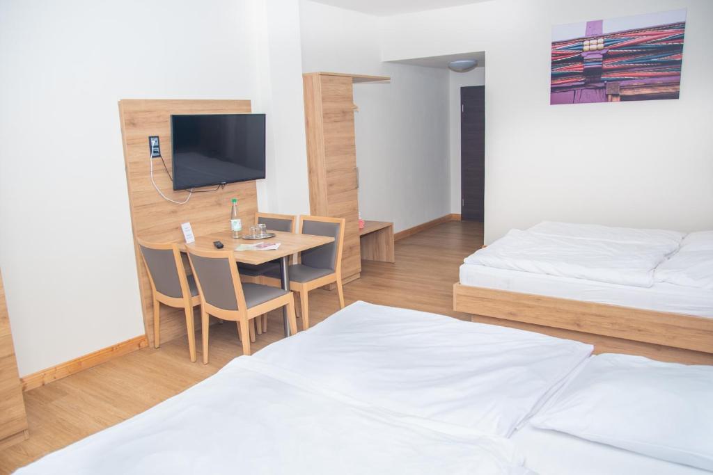 Postel nebo postele na pokoji v ubytování Hotel Fulda