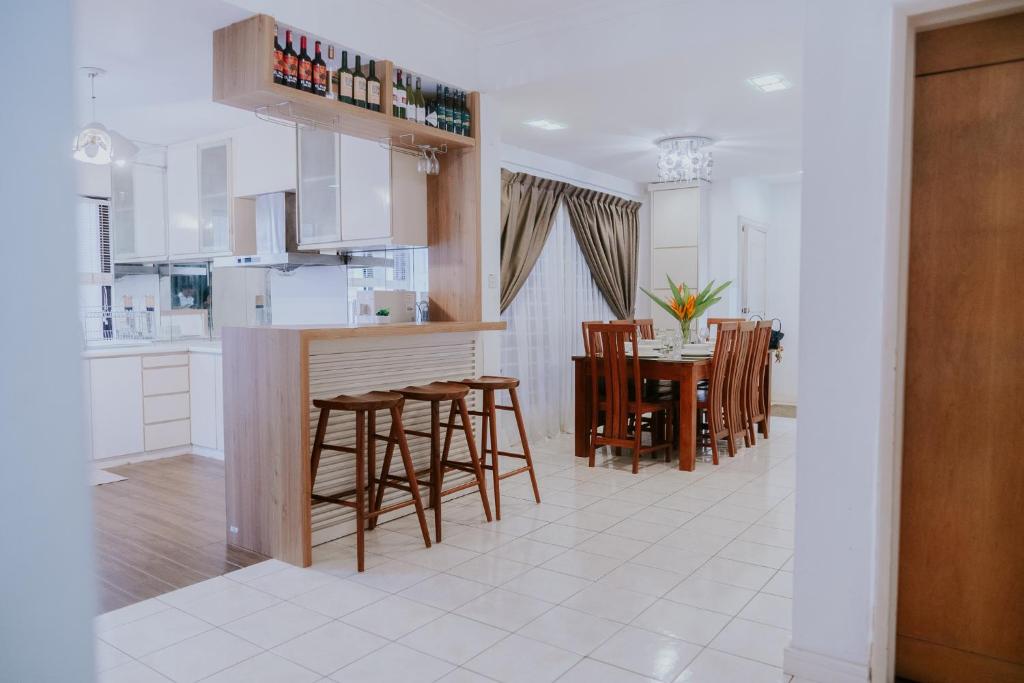 a kitchen and dining room with a table and chairs at Petronella Apartment C1 Marina Court in Kota Kinabalu