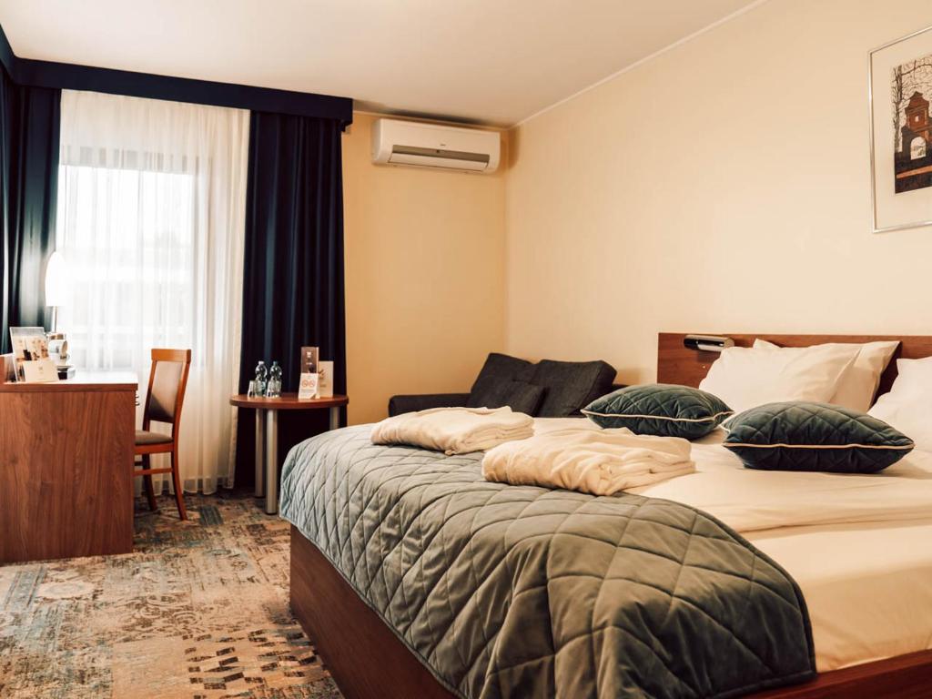 Posteľ alebo postele v izbe v ubytovaní Hotel Mrągowo Resort&Spa
