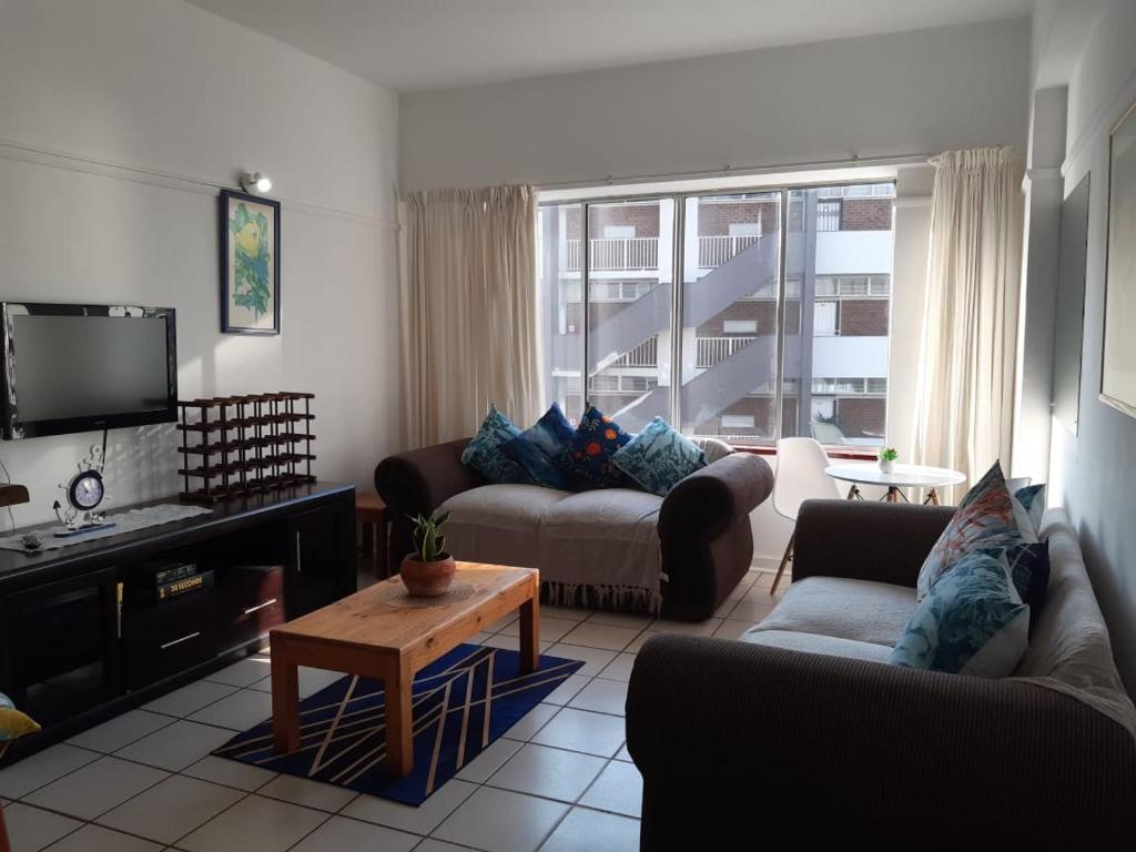 a living room with two couches and a tv at Seabrook 306 in Margate