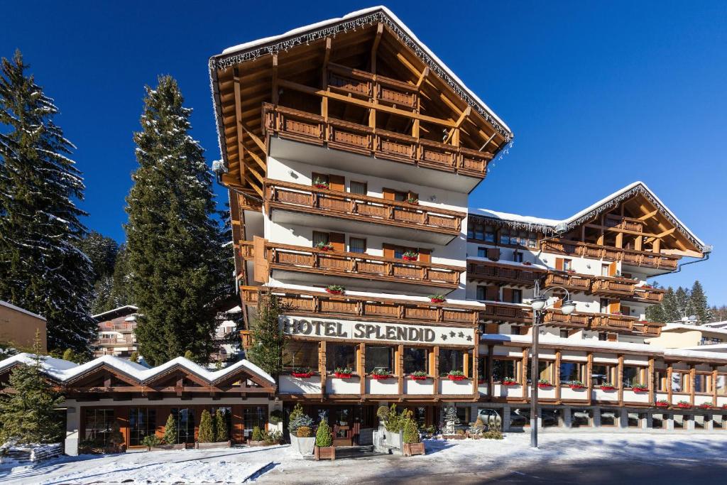 a large building with a ski resort at Hotel Splendid in Madonna di Campiglio
