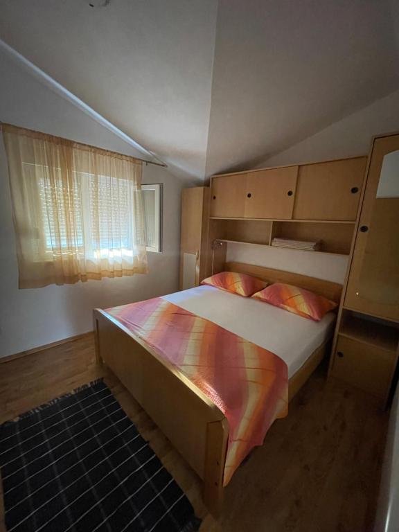 Postel nebo postele na pokoji v ubytování Apartman Jukic
