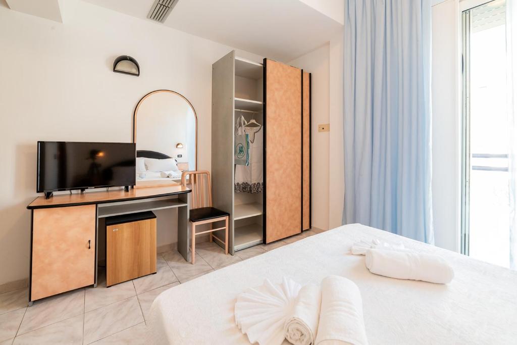 Postel nebo postele na pokoji v ubytování Hotel Ambasciatori
