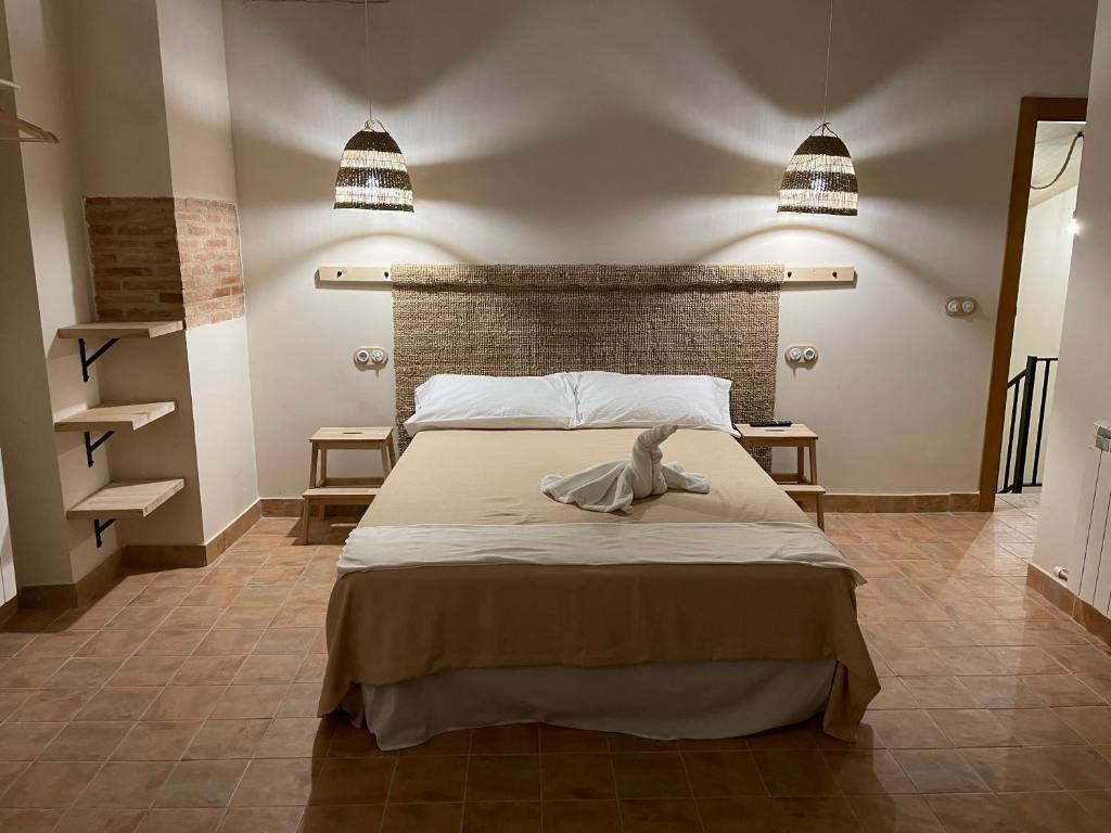 a bedroom with a bed with a swan on it at Casa Bulbón in Bulbuente