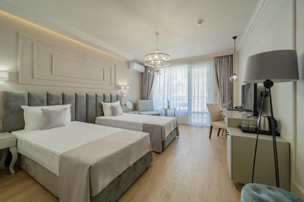 Postel nebo postele na pokoji v ubytování Aquamarine - Beach & SPA Hotel- All inclusive