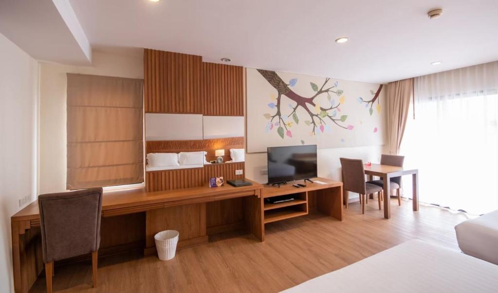 TV a/nebo společenská místnost v ubytování Areca Lodge