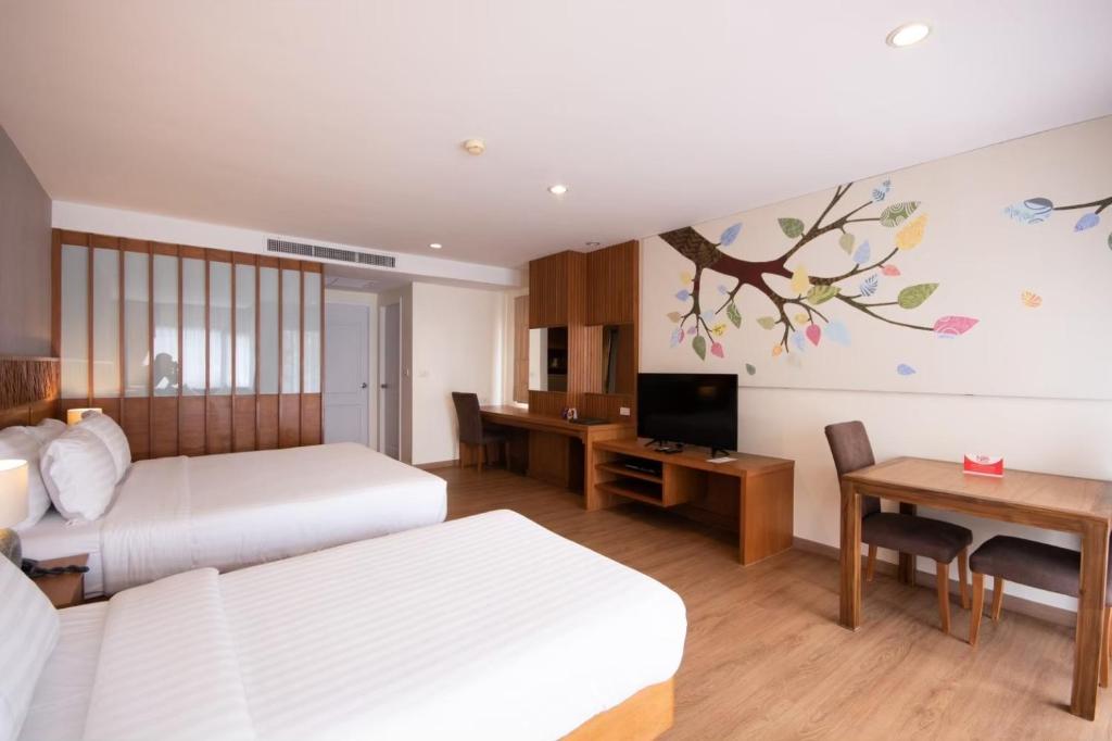 Postel nebo postele na pokoji v ubytování Areca Lodge