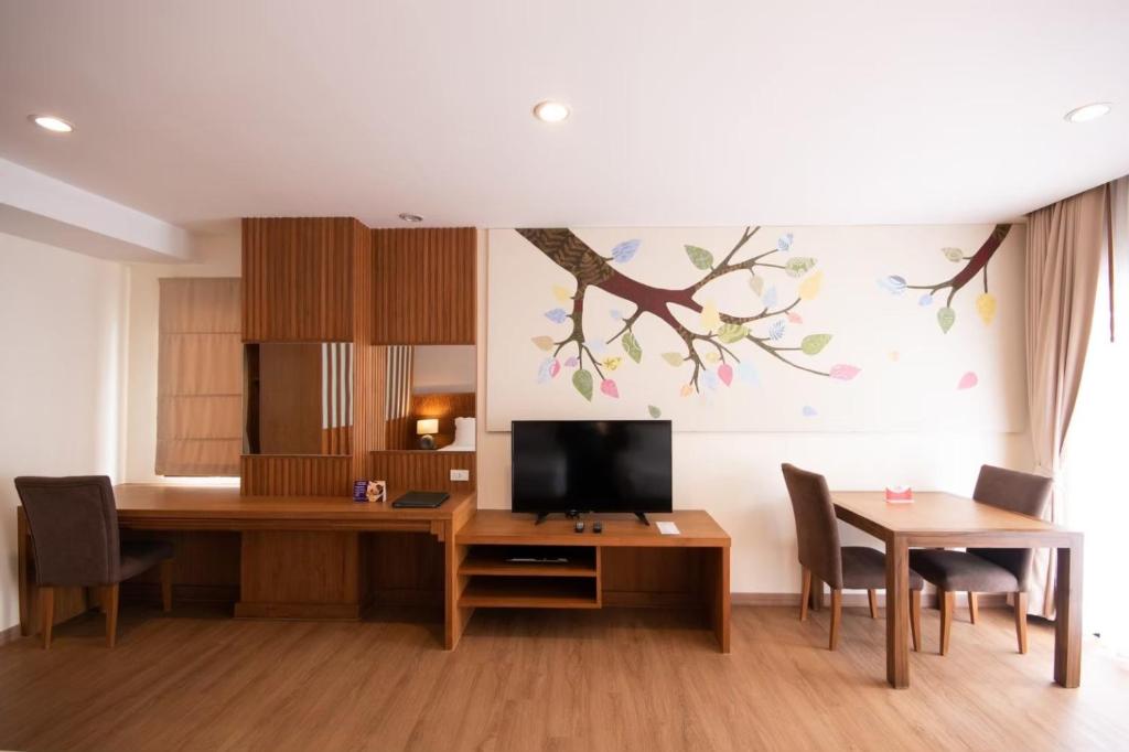TV a/nebo společenská místnost v ubytování Areca Lodge