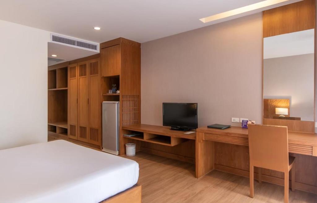 Postel nebo postele na pokoji v ubytování Areca Lodge