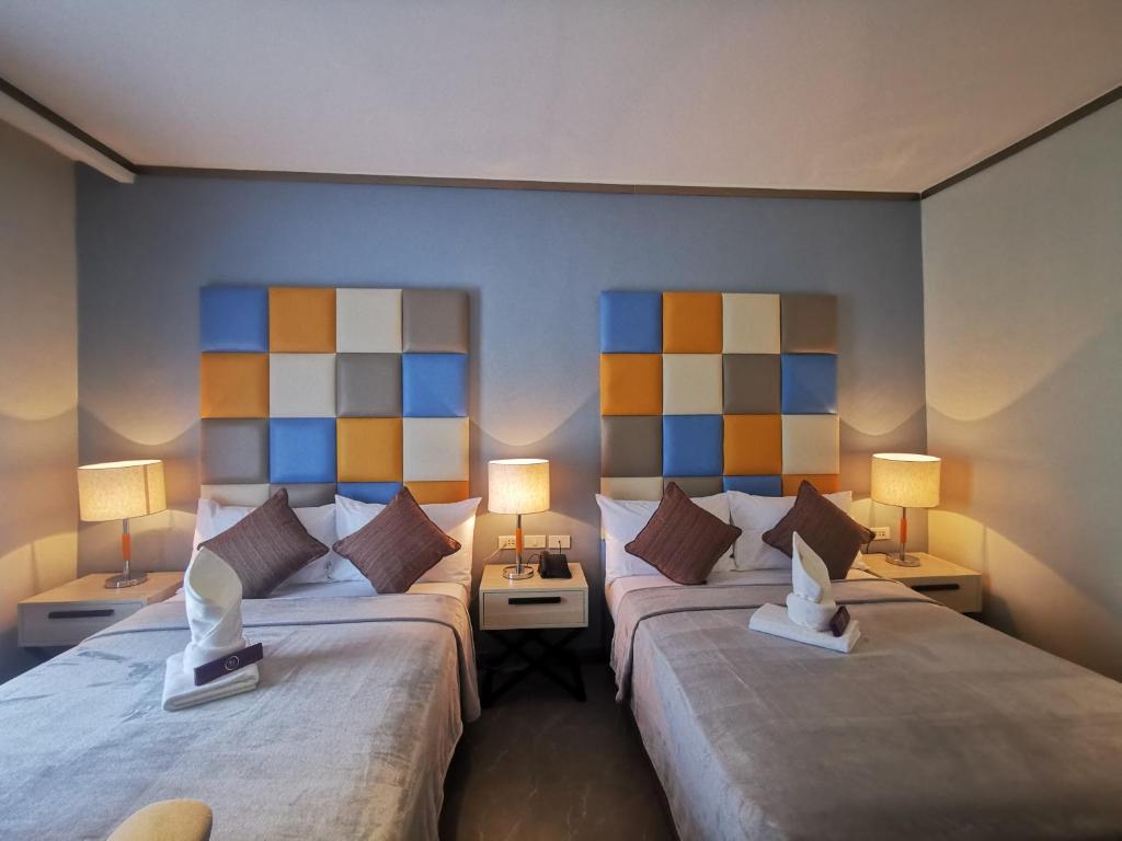 Postel nebo postele na pokoji v ubytování Yes Hotel Pandi Bulacan