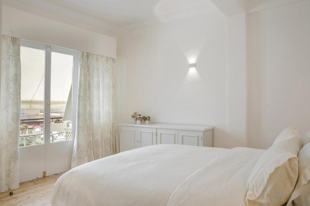 Posteľ alebo postele v izbe v ubytovaní Etoile Luxury Suites