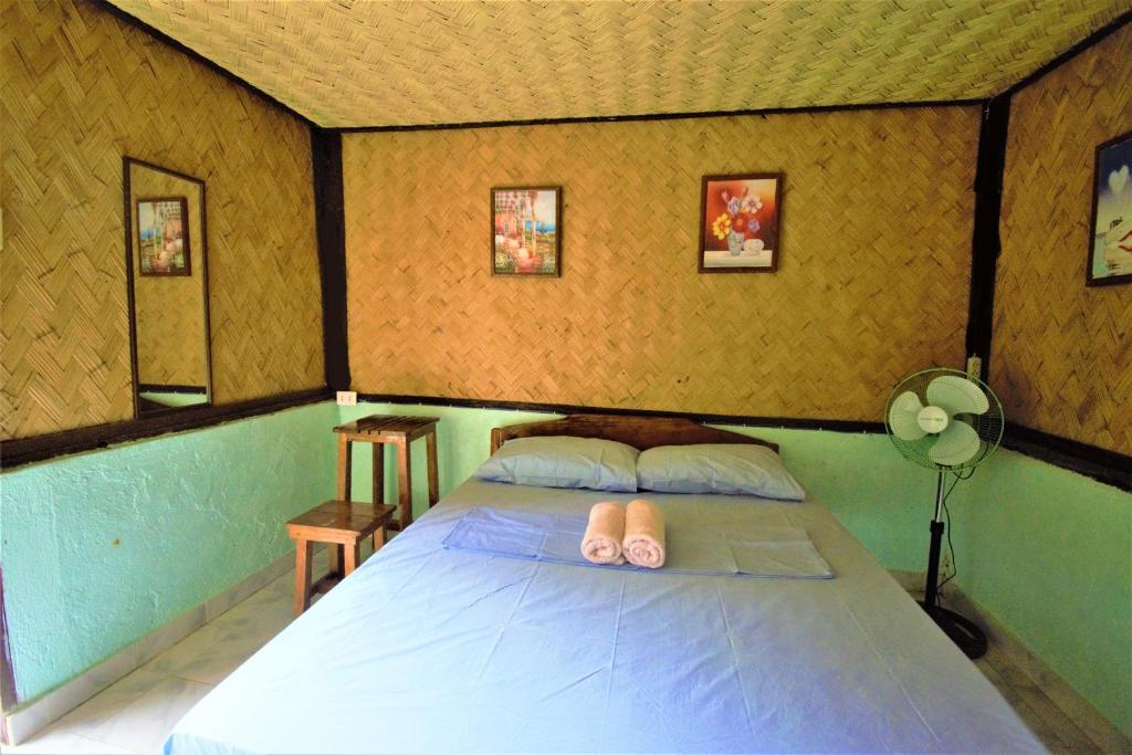 Postel nebo postele na pokoji v ubytování Concepcion Divers Lodge