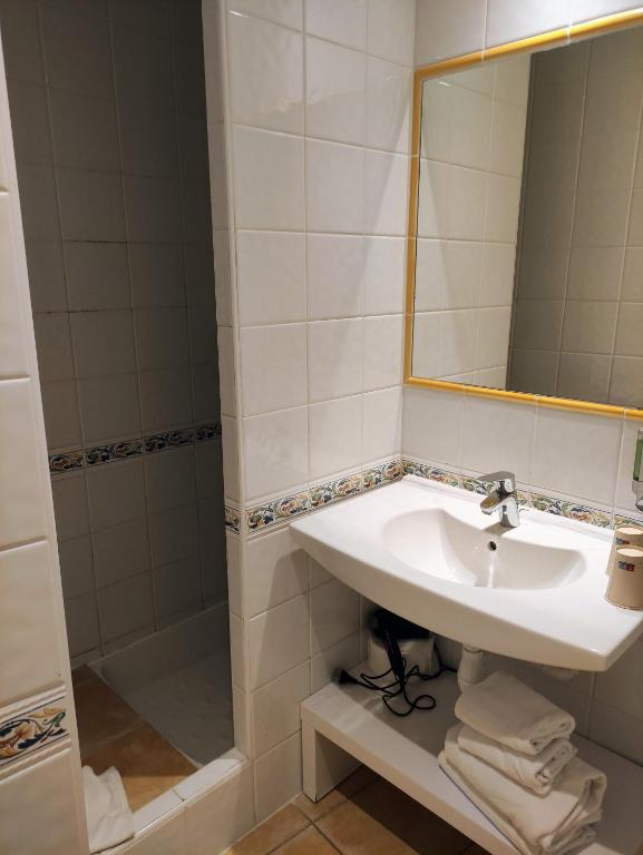 Koupelna v ubytování Hotel Le Golfe