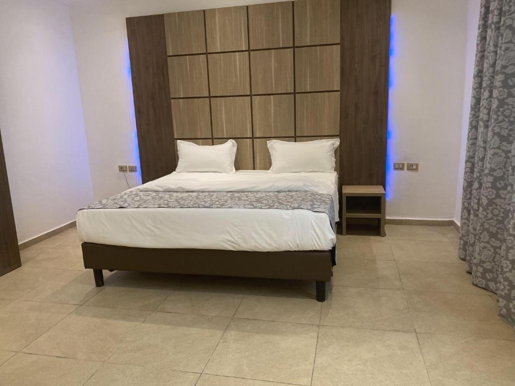 Postel nebo postele na pokoji v ubytování Hotel Franco Yaounde