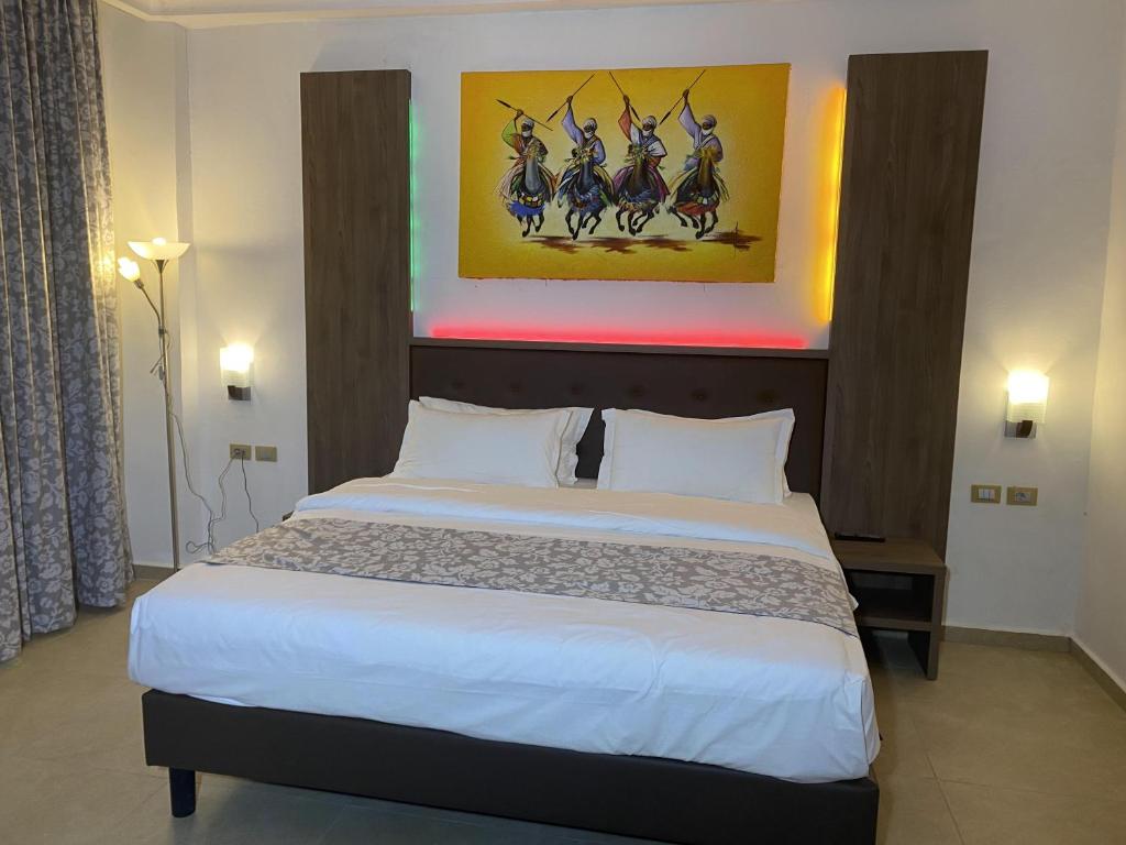 Postel nebo postele na pokoji v ubytování Hotel Franco Yaounde