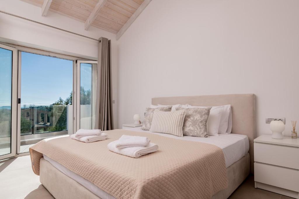 Postel nebo postele na pokoji v ubytování Villa di Pietra