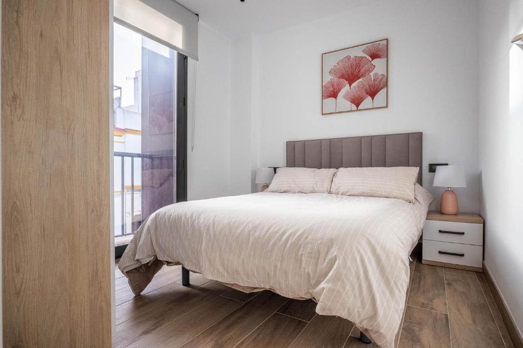 Posteľ alebo postele v izbe v ubytovaní Nervión Suites 2 - Vacacional Sevilla