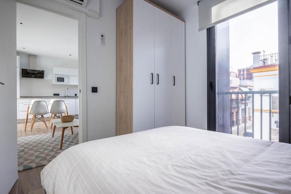 Posteľ alebo postele v izbe v ubytovaní Nervión Suites 2 - Vacacional Sevilla