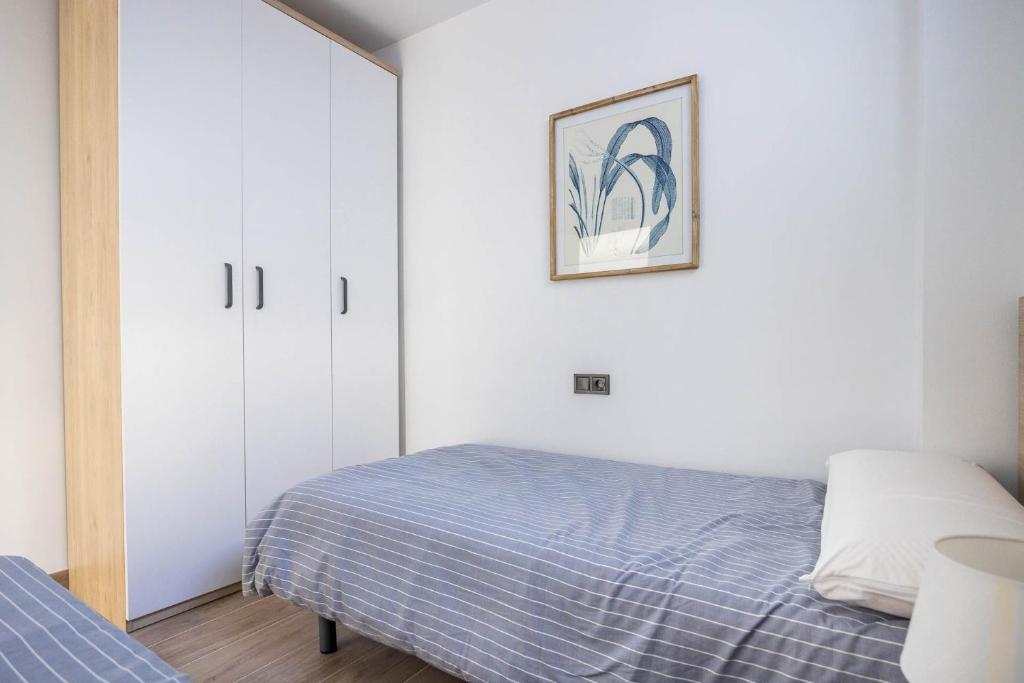 Posteľ alebo postele v izbe v ubytovaní Nervión Suites 2 - Vacacional Sevilla