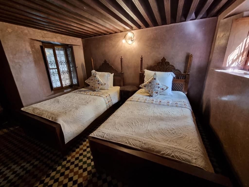 Postel nebo postele na pokoji v ubytování Riad Le Sucrier de Fès