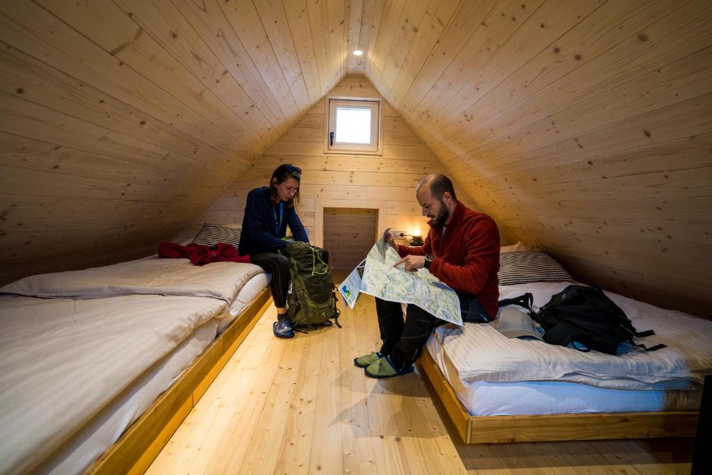 Postel nebo postele na pokoji v ubytování Chalet Velika Planina - I FEEL ALPS