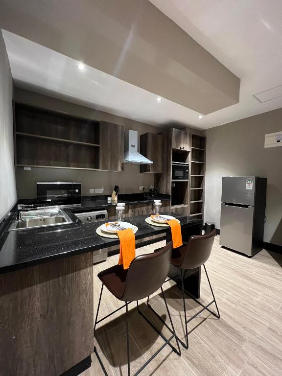 Kuchyň nebo kuchyňský kout v ubytování Sincerely Yours Suites & Serviced Apartments