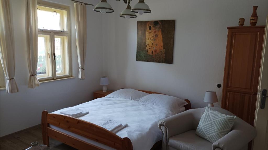 Posteľ alebo postele v izbe v ubytovaní Guesthouse Tulipán Vendégház