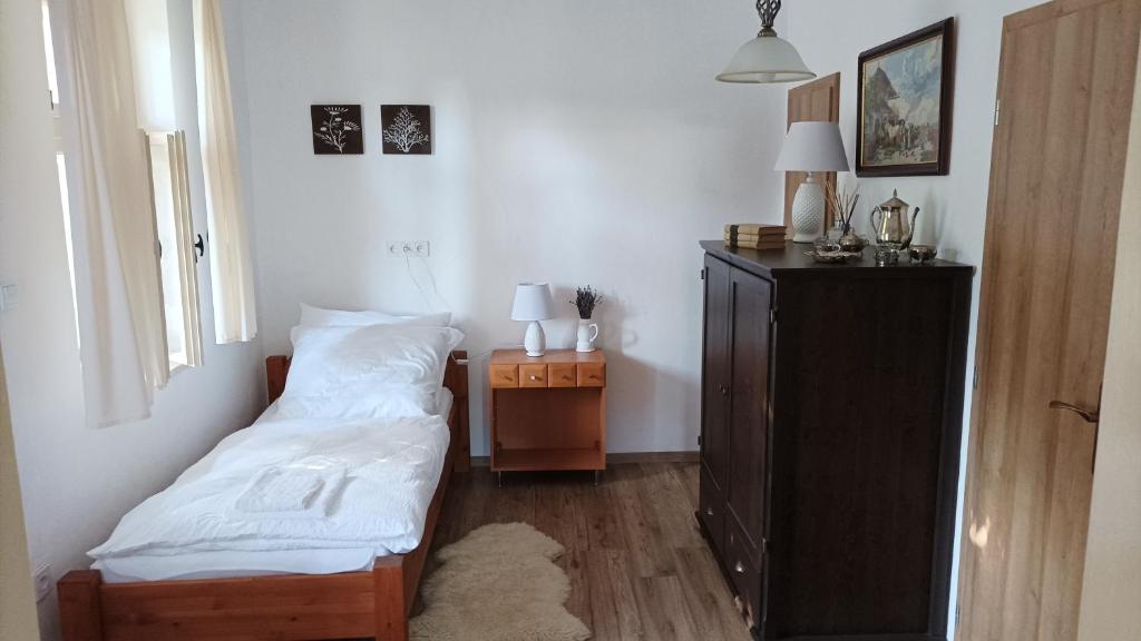 Posteľ alebo postele v izbe v ubytovaní Guesthouse Tulipán Vendégház