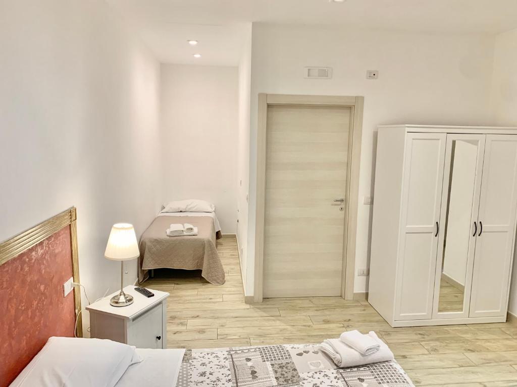 A bed or beds in a room at Romano B&B