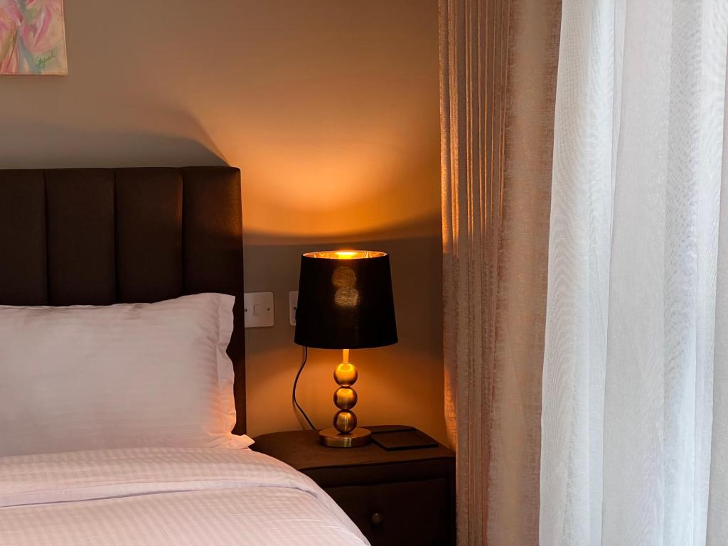 Postel nebo postele na pokoji v ubytování Sincerely Yours Suites & Serviced Apartments