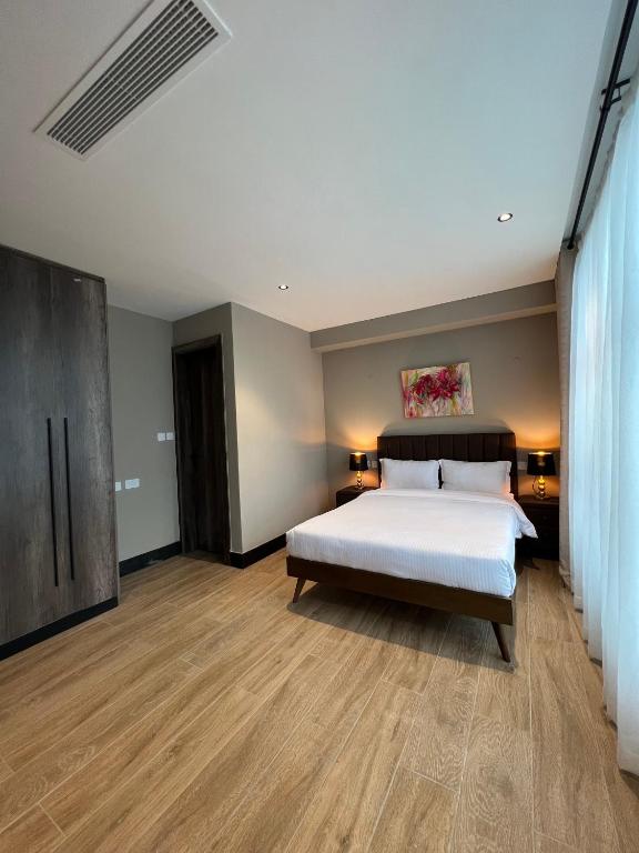 Postel nebo postele na pokoji v ubytování Sincerely Yours Suites & Serviced Apartments