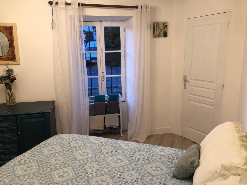 Łóżko lub łóżka w pokoju w obiekcie Gîte des Lavandes