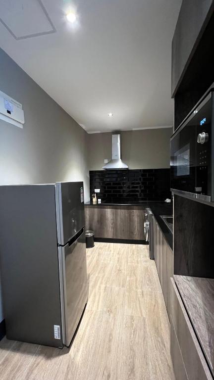 Kuchyň nebo kuchyňský kout v ubytování Sincerely Yours Suites & Serviced Apartments