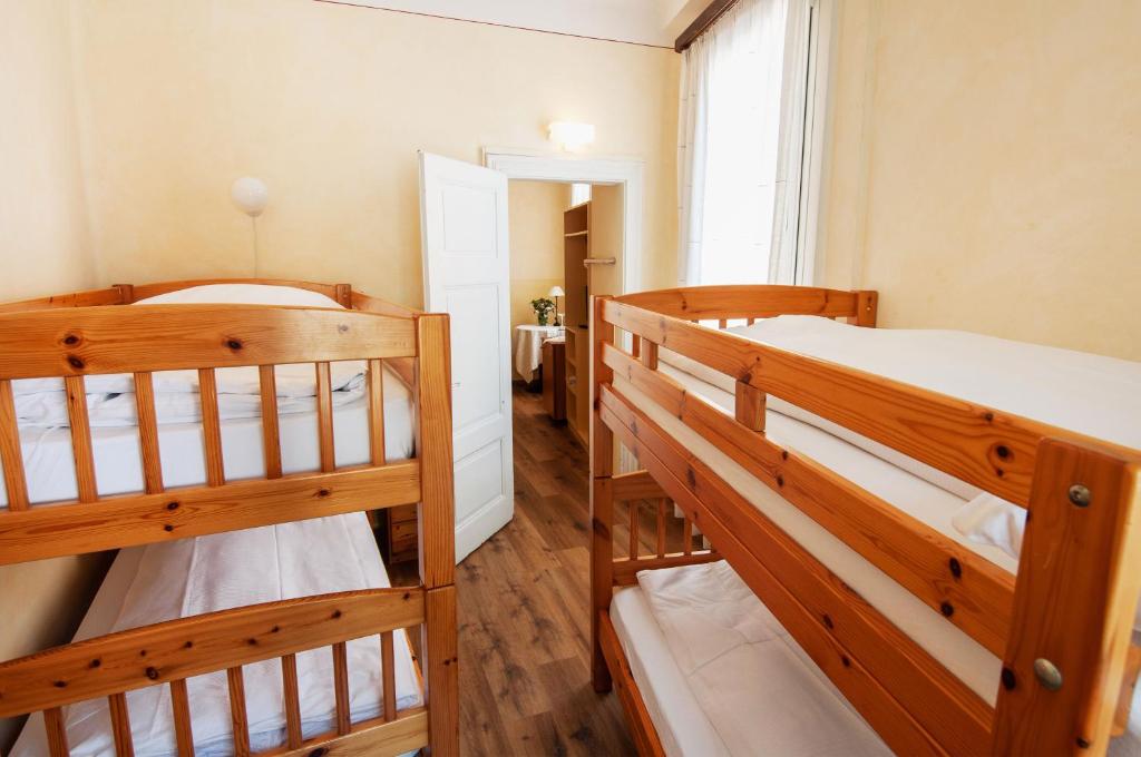 Postel nebo postele na pokoji v ubytování Rustico by Al Giardinetto