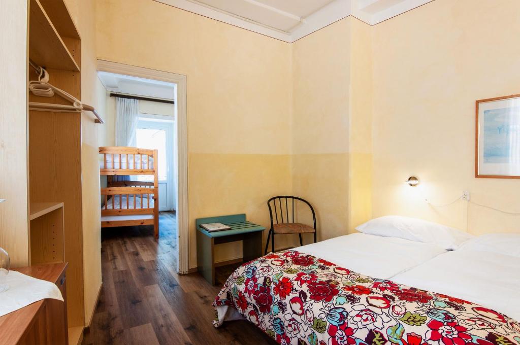 Postel nebo postele na pokoji v ubytování Rustico by Al Giardinetto