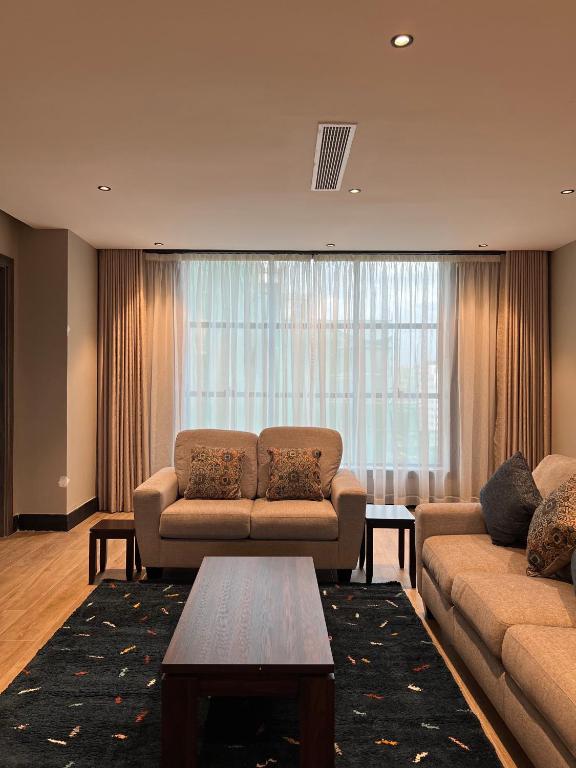 Posezení v ubytování Sincerely Yours Suites & Serviced Apartments