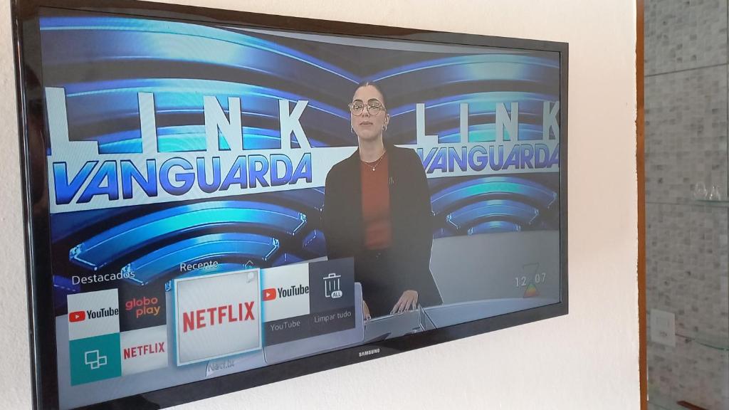 TV a/nebo společenská místnost v ubytování Suíte Alto do Aconchego