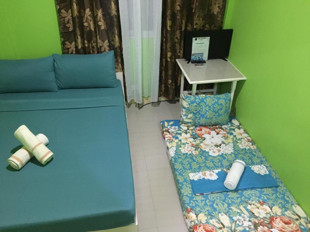Postel nebo postele na pokoji v ubytování Twin AP Homes