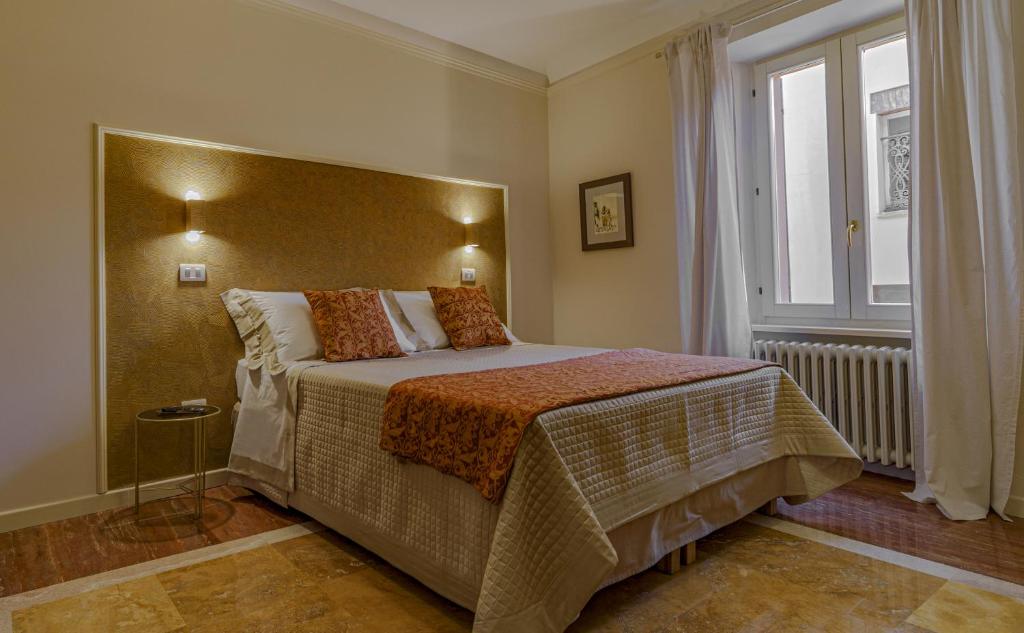 Postel nebo postele na pokoji v ubytování Il Cortile Segreto