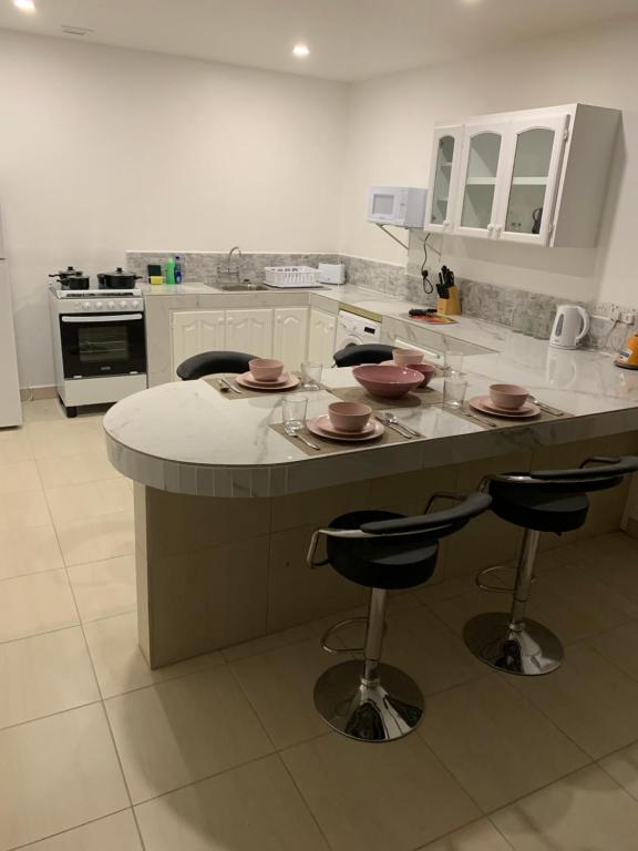 Kuchyň nebo kuchyňský kout v ubytování Kay Nou Apartments