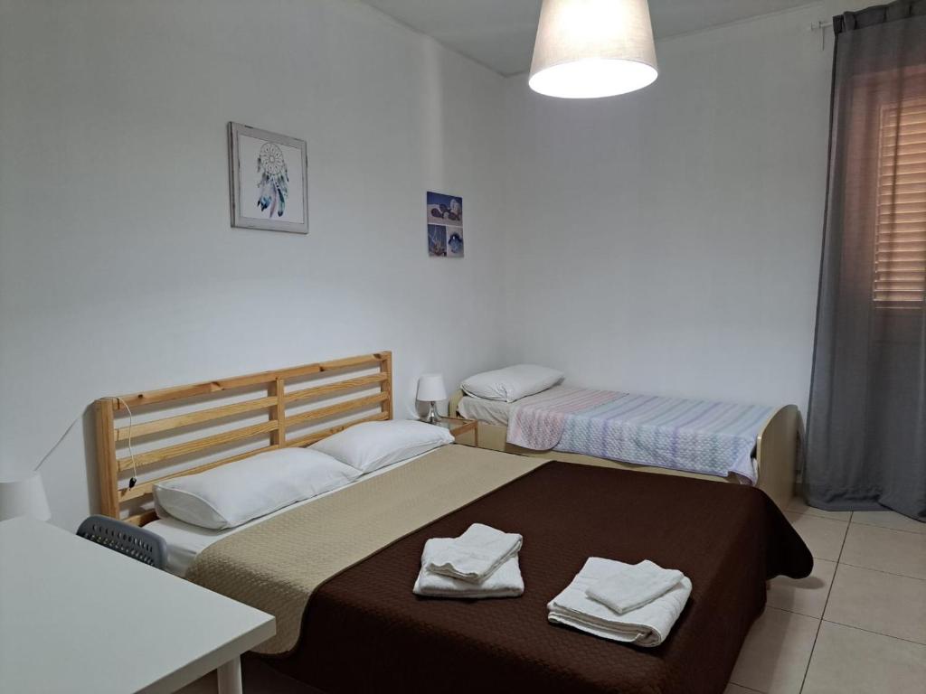 Letto o letti in una camera di Le Comete di Angelo